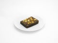 Chocolate brownie on a white plate in white background. Royalty Free Stock Photo