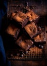 Chocolate brownies with blueberries on rustic wooden surface. Generative Ai Royalty Free Stock Photo