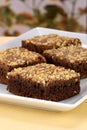 Chocolate brownies with cracked peanuts on top Royalty Free Stock Photo