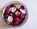 Chocolate budino with dryed raspberry and corn flakes in a glass jar