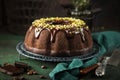 Chocolate bundt cake with chocolate glaze and pistachios Royalty Free Stock Photo