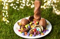 Chocolate bunny, eggs and candy drops on plate Royalty Free Stock Photo