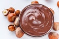 Chocolate butter and hazelnuts on a white acrylic background Royalty Free Stock Photo