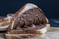 Chocolate butter spread on bread while cooking breakfast Royalty Free Stock Photo