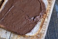 Chocolate butter spread on bread while cooking breakfast Royalty Free Stock Photo