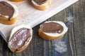 Chocolate butter spread on bread while cooking breakfast Royalty Free Stock Photo