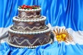 Chocolate cake on the Argentinean flag background, 3D rendering