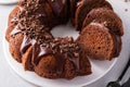 Chocolate cake baked in a bundt pan with chocolate ganache glaze Royalty Free Stock Photo