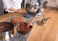 Chocolate cake baking ingredients on kitchen table with kitchenware, top view Royalty Free Stock Photo