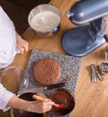 Chocolate cake baking ingredients on kitchen table with kitchenware, top view Royalty Free Stock Photo