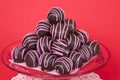 Chocolate cake balls stripped pink candy melts stacked on plate Royalty Free Stock Photo