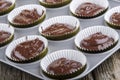 Chocolate cake batter in a cupcake case Royalty Free Stock Photo