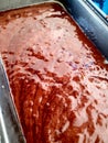 Chocolate cake batter in pan before baking Royalty Free Stock Photo