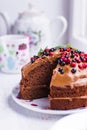 Chocolate cake with berries and cream