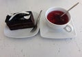 Chocolate cake and berry tea in a cafe