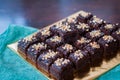 Chocolate Cake Brownie Squares Drizzled With Chocolate Nutella and Walnuts.