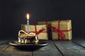 Chocolate cake with a candle and gifts. Happy Birthday, card. Holidays greeting card. Royalty Free Stock Photo