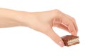 Chocolate cake candy biscuit milk in hand Royalty Free Stock Photo