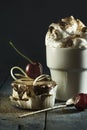 Chocolate cake with cherries and a cup of coffee with whipped cream. Royalty Free Stock Photo