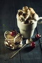 Chocolate cake with cherries and a cup of coffee with whipped cream. Royalty Free Stock Photo