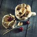 Chocolate cake with cherries and a cup of coffee with whipped cream. Royalty Free Stock Photo