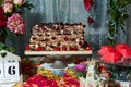 Chocolate cake with cherries on festive table. Candy bar and sweet cherry pastry for Birthday party or event.