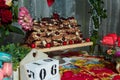 Chocolate cake with cherries on festive table. Candy bar and sweet cherry pastry for Birthday party or event