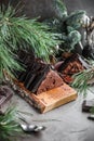 Chocolate cake with chocolate cream and glaze decorations on a wooden board Royalty Free Stock Photo