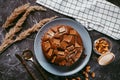 Chocolate cake with chocolate pieces on a metallic black background