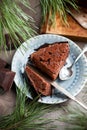 Chocolate cake with chocolate cream and glaze decorations on a wooden board Royalty Free Stock Photo