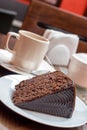 Chocolate cake and cup of tea or coffee Royalty Free Stock Photo