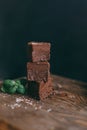 Chocolate cake cut with squares on a black background Royalty Free Stock Photo