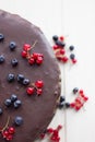 Chocolate cake decorated berry on white background. Blur image c
