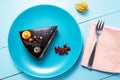 Chocolate cake with decoration and fruits wooden blue background Royalty Free Stock Photo