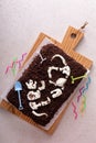 Chocolate cake with dinosaur bones for a child birthday