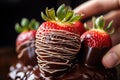 Chocolate cake with fresh strawberries on a dark background. Selective focus, A close-up of a hand-dipped chocolate covered