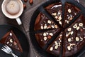 Chocolate cake with hot chocolate sauce and fried hazelnuts Royalty Free Stock Photo