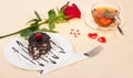 Chocolate cake, hot tea and red rose Royalty Free Stock Photo