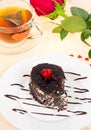 Chocolate cake, hot tea and red rose Royalty Free Stock Photo