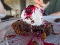 Chocolate cake with ice cream and red fruits jam Royalty Free Stock Photo