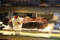 Chocolate cake and ice-cream in the shopwindow