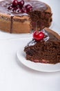 Chocolate cake with juicy cherries