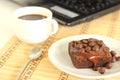 Chocolate cake and labtop Royalty Free Stock Photo