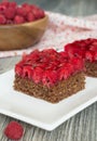 Chocolate cake with nuts and raspberry jelly filling Royalty Free Stock Photo