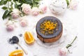 Chocolate cake with orange and icing. On a white background, and a bouquet of white roses. Good morning with a surprise and Royalty Free Stock Photo