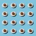 chocolate cake pattern on a white saucer on a blue background Royalty Free Stock Photo