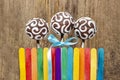 Chocolate cake pops and colorful rainbow fence