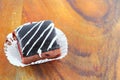 Chocolate cake pour cream on wooden floor background select focus with shallow depth of field