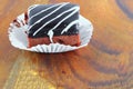 Chocolate cake pour cream on wooden floor background select focus with shallow depth of field