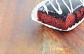 Chocolate cake pour cream on wooden floor background select focus with shallow depth of field